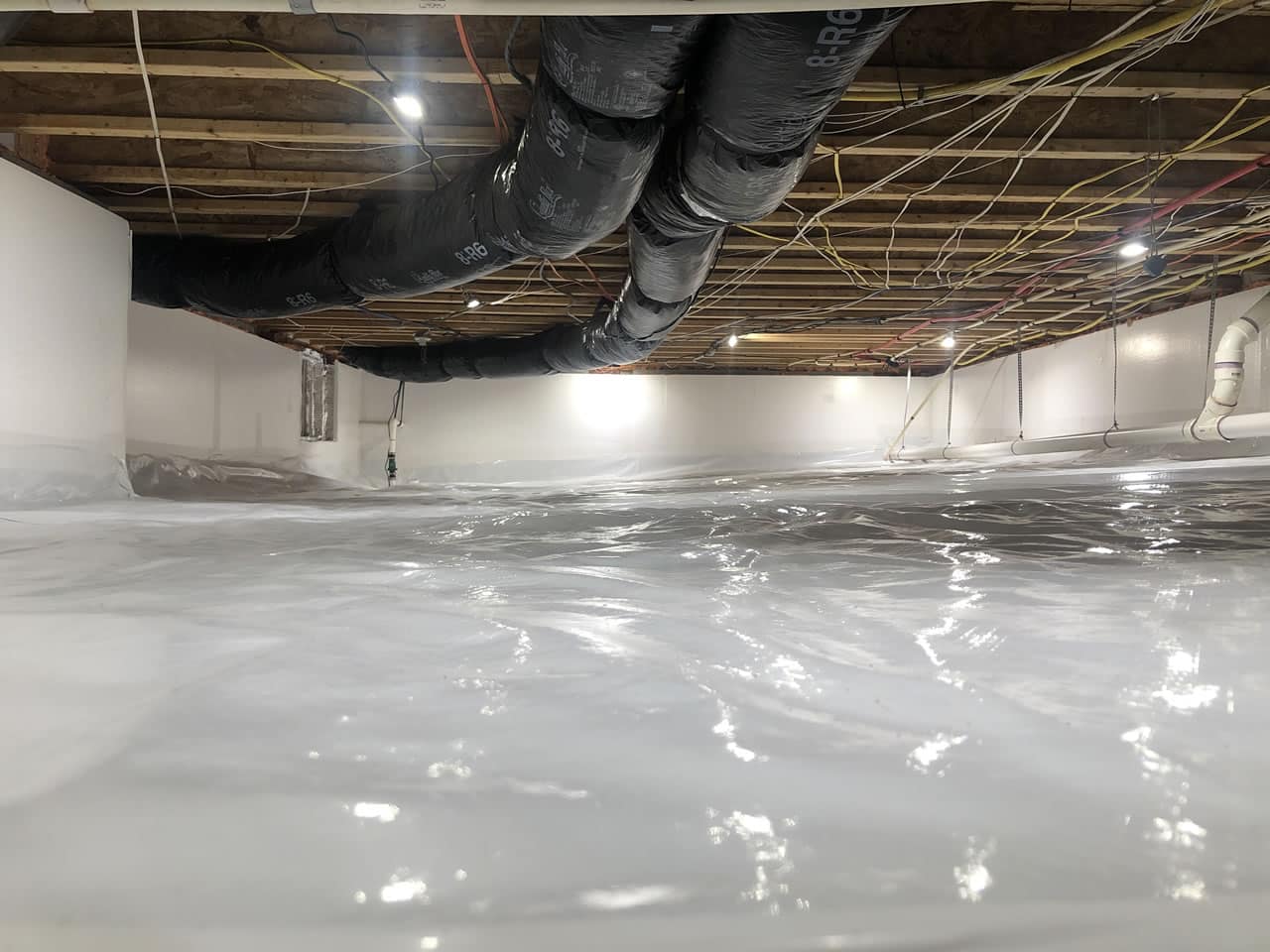 Professionally installed crawl space encapsulation system featuring a sealed vapor barrier that protects against moisture, mold, and energy loss.