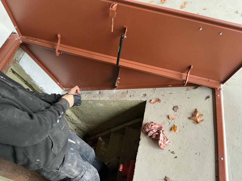 Open Bilco hatchway door installation in Naugatuck CT showing basement access and secure steel construction